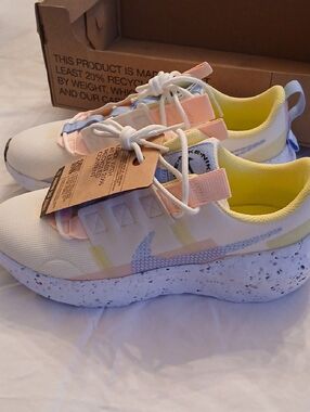 Nike Sneakers in White with Pastel Pink, Yellow & Blue Accents